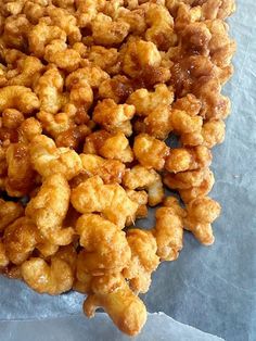 a pile of fried food sitting on top of a piece of paper