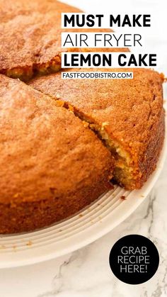 a close up of a cake on a plate with the words must make air fryer lemon cake