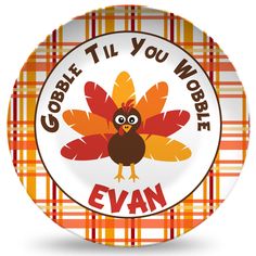 a plate with an image of a turkey and the words gobble til you wobble evan on it