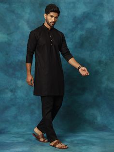 VASTRAMAY Men's Black Cotton Blend Kurta Pyjama Set Elevate your ethnic wear collection with this classic black kurta pyjama set from VASTRAAY. Made from a comfortable cotton blend, this set is perfect for festive occasions, casual wear, or lounging at home. Features: Black, knee-length kurta with mandarin collar Long sleeves with button placket Black, mid-rise pyjama with drawstring closure Two side pockets for added functionality Specifications: Material: Cotton blend (exact blend percentage m Mandarin Collar, White Cotton, Classic Black, Black Cotton, Outfit Sets, Pajama Set, Knee Length, Casual Wear, Pajamas