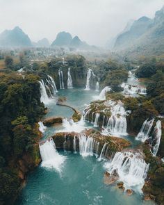 an aerial view of waterfalls in the water