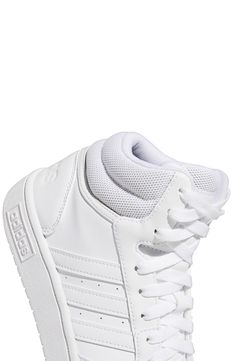 Signature brand logo 3-stripe detail meets a pair of mid top sneakers with a lace-up closure for a street inspired look. Round toe Lace-up style Cushioned insole White sole Synthetic leather upper, rubber sole Imported Adidas High-top Lace-up Sneakers With Three Stripes Branding, Adidas High-top Lace-up Sneakers With Three Stripes, Adidas Lace-up High-top Sneakers With Three Stripes Branding, White High-top Sneakers With Elastic Laces For Streetwear, Adidas Logo Sporty Lace-up High-top Sneakers, White Basketball Shoes With Elastic Laces For Streetwear, Adidas High-top Sneakers With Elastic Laces, Adidas Logo High-top Lace-up Sneakers, Adidas High-top Lace-up Sneakers For Streetwear