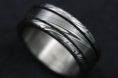 This Genuine handmade Stainless Damascus ring is a 3 piece ring press fit and welded with all hypoallergenic stainless damascus and stainless damascus steel ring body. The ring is finished off with a polished finish which I personally wear as my wedding band! In the notes add your size and 7 or 8mm width. Brushed Finish Stainless Steel Rings For Gift, Stainless Steel Ring With Brushed Finish As Gift, Stainless Steel Ring With Brushed Finish For Gift, Titanium Ring With Brushed Finish As Gift, Titanium Ring With Brushed Finish For Gift, Titanium Rings With Brushed Finish For Gift, 3 Piece Ring, Damascus Ring, Damascus Steel Ring