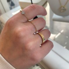 These stackable rings are effortless and dainty! Get them for one finger or spread 'em across different fingers. Pairs great with rings you already have! Solid 14K yellow gold Chain is approx 1 mm wide PRODUCTION & RETURNS Made to order - Production time: 2 business days Final sale no returns (please make sure to order your ring size) SIZING NOTES: Sizing is more flexible and may stretch up to 1/4 size. These rings are soft not hard (i.e. they don't keep a round shape). The best way to put them Chain Ring Gold, One Finger, Adjustable Bangle, Jewelry Lookbook, Thumb Rings, Yellow Gold Chain, Fine Earrings, Kids Jewelry, Chain Ring