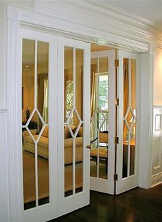 an open white door leading to a bedroom