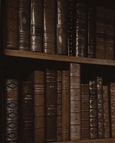 an old book shelf filled with lots of books