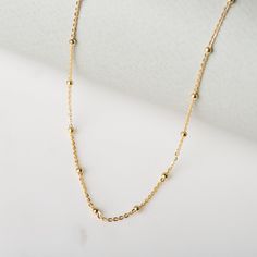 "Dainty and simple, this delicate satellite choker necklace will go with absolutely anything. Perfect worn on its own or layered with longer necklaces. * D E T A I L S * ∙ Material: .925 Sterling Silver or 18K Gold Plated over .925 Sterling Silver ∙ Adjustable length. Available in two sizes: 30cm + 8cm extension chain (12 to 15 inches) & 35cm + 5cm extension chain (14 to 16 inches) ∙ Hypoallergenic & nickel-free * P A C K A G I N G * ∙ All jewelry is sent out beautifully packaged in our Ball Chain Necklace Gold, Dainty Necklace Layered, Chain Necklace Gold, Ball Chain Necklace, Gold Choker, Dainty Necklace, Ball Chain, Long Necklace, Choker