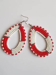 This listing is for ALL 11 pairs. The earrings are 100% handmade using original fine beads. Colorful and bright colors. ^^These earrings ships through dhl express. More earrings; https://www.etsy.com/shop/TribalTess?ref=seller-platform-mcnav&section_id=21293980 Buy multiple items and pay shipping for ONE item ONLY. White Beaded Teardrop Earrings, Traditional White Hoop Earrings With Ear Wire, Adjustable Large Beaded Earrings, Traditional White Earrings With Ear Wire, Traditional White Round Bead Earrings, Traditional Beaded Earrings For Beach, Oval Beaded Earrings Gift, Red Teardrop Earrings For The Beach, Red Teardrop Earrings For Beach