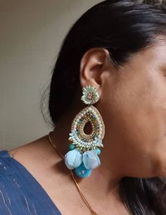 "Bohemian handmade statement turquoise blue embellished large earrings. These beautiful turquoise earrings are hand crafted beautifully using various material like fabric, glass, chatton,pompoms etc. An ideal summer party earrings The rarrings measure about approx. 3.80\" long and 2.20\" wide. Each beautiful Carnation jewellery piece is handcrafted in India and ship from India. Please note, Since our product is purely handmade in nature hence a slight imperfection may be there. But I try and mak Turquoise Earrings For Wedding And Festivals, Blue Latkans Danglers For Party, Blue Danglers With Latkans For Party, Handmade Blue Chandelier Earrings, Blue Party Danglers With Latkans, Bohemian Blue Earrings For Party, Bohemian Beaded Drop Bridal Earrings, Bohemian Beaded Bridal Drop Earrings, Handmade Bohemian Bridal Earrings For Party