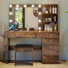 a dressing table with lights on it and a stool in front of the vanity mirror