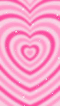 a pink heart with stars in the background