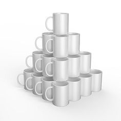 a stack of white coffee mugs sitting next to each other on top of one another