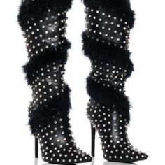 A Boot Like A Beautiful Flower. The Azalea Wang " Fancy Phenom " Feather Embellished Boot In Black Is An Ultra-Sexy Faux Leather Boot Featuring A Pointed Toe Silhouette, A Slim Stiletto Heel, And A Knee-Height Shaft. Complete With A Spiral Of Real Feather Plumes Encircling The Shaft, Rhinestone Studded Detailing Throughout, And A Pull-On Fit. Style With A Sleek Mini Skirt, An Oversized Band Tee, And A Faux Leather Jacket For A Complete Look. - Faux Leather Upper - Pointed Toe - Stiletto Heel - 1 Winter Party Boots With Spikes, Glamorous Leather Heels For Winter, Chic Embellished Heels For Winter, Glamorous Winter Leather Heels, Glamorous Leather Boots With Silver Studs, Winter Evening Boots With Metal Feet, Glamorous Party Boots With Silver Studs, Luxury Boots For Fall Party, Luxury Fall Boots For Parties