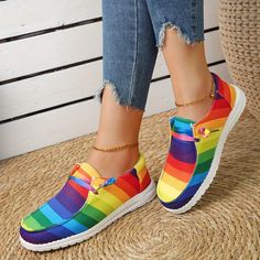 These rainbow striped canvas shoes for women have a lightweight design that provides both comfort and versatility, making them the perfect walking shoes. Made of breathable canvas, they are ideal for a variety of activities, whether it's a daily walk or a hike across challenging terrain. Item ID : TW16224 Patterned : Other Material : Canvas Toe Style : Round toe Casual Multicolor Slip-on Sneakers For Spring, Fabric Canvas Shoes With Flat Heel, Flat Heel Fabric Canvas Shoes, Trendy Multicolor Canvas Shoes With Vulcanized Sole, Trendy Summer Canvas Slip-on Sneakers, Casual Multicolor Slip-on Canvas Shoes, Multicolor Slip-on Canvas Shoes For Summer, Summer Multicolor Lace-up Canvas Shoes, Comfortable Multicolor Flat-heel Sneakers