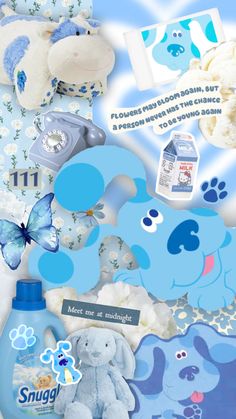 a blue teddy bear surrounded by baby items