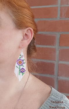 These handmade unique earrings with abstract floral print are made of high-quality Czech beads and strong synthetic thread. I use my author's scheme . They are elegant, fashionable, and highly versatile, suitable for everyday wear. Color: white,pink,purple,red,orange, green . 100% hand made with love! I beg you not to copy my authoring Copy without my permission is prohibited For those who want to buy my copyright scheme for these earrings: https://www.etsy.com/uk/listing/974991392/brick-stitch- White Dangle Flower Earrings With Colorful Beads, White Flower Dangle Earrings With Colorful Beads, White Flower Drop Earrings For Summer, White Beaded Adjustable Flower Earrings, White Flower Shaped Beaded Earrings With Colorful Beads, White Dangle Flower Earrings With Beads, White Handmade Bohemian Earrings, White Flower Earrings With Dangling Beads For Gift, Handmade White Bohemian Earrings