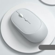 a computer mouse sitting on top of a white plate