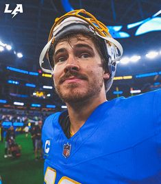 a close up of a person wearing a football uniform