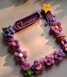 a cake decorated with purple flowers and stars