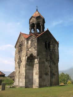 an old stone church with a bell tower