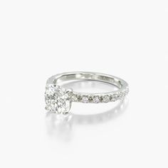 a diamond engagement ring on a white background