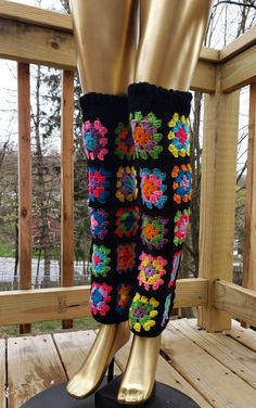 there is a pair of crocheted boots on display