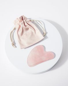 100% natural Rose Quartz Gua Sha tool WHAT ARE THE BENEFITS? 🌸 Boosts blood circulation 🌸 Reduces puffiness 🌸 Aids lymphatic drainage 🌸 Relieves muscle tension and stress 🌸 Tones and contours the face 🌸 Rose Quartz is known as a crystal for universal love DESCRIPTION:  Boost your skincare routine with our Rose Quartz Gua Sha tool.  Originating from ancient China, Gua Sha is the practice of running a flat-edged tool along your skin. The gentle, sweeping movements of the tool aid to boost ci Facial Gua Sha, Gua Sha Stone, Rose Quartz Gua Sha, Skincare Gifts, Gua Sha Massage, Gua Sha Tools, Suede Bag, Face Massage, Skin Care Gifts