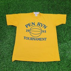 Vintage Pen Basketball Tournament Shirt M/L 20x25 Yellow Get this vintage Pen Basketball Tournament shirt in yellow, size M/L 20x25. Perfect for sports enthusiasts and collectors!  * Used condition  * Tag says L measures as M/L listed as L-Short Athletic  * Length is on the shorter side  * No rips/holes  * No stains  * Normal fading from washing  * Normal cracking on the graphic VINTAGE PEN BASKETBALL TOURNAMENT SHIRT, VINTAGE SPORTS SHIRT, YELLOW VINTAGE TEE, M/L VINTAGE SHIRT, RETRO BASKETBALL SHIRT, PEN TOURNAMENT GEAR, MEDIUM LARGE SHIRT, 20X25 SHIRT, YELLOW SPORTS TEE, VINTAGE ATHLETIC SHIRT 67165 Vintage Running, Vintage Pens, Retro Basketball, Lake Elsinore, Basketball Tournament, Vintage Basketball, Running Club, Sports Tee, Basketball Shirts