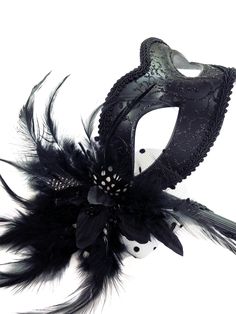 Perfect for any masquerade ball or costume party, this mask is with a holding stick for the freedom to expose your true identity effortlessly. Elegantly decorated with matching black feathers for finishing touches. Thank you for supporting small businesses and hope our products bring you and loved ones some joy and humor in these trying times. S H I P P I N G - Current processing times range 5-7 days. Pls note expedited & 1-2 day guaranteed delivery services offered will still require the same p Handheld Masquerade Mask, Black Eye Mask For Theater Costume Accessories, Black Eye Mask For Theater Costume, Black Eye Mask For Theater, Black Carnival Mask Costume Accessory, Black Mask For Carnival, Black Gothic Eye Mask For Masquerade, Black Eye Mask For Masquerade, Gothic Black Eye Masquerade Mask