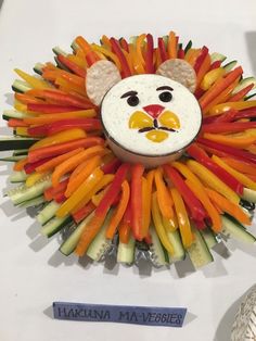 a lion made out of veggies is on display at the museum's booth