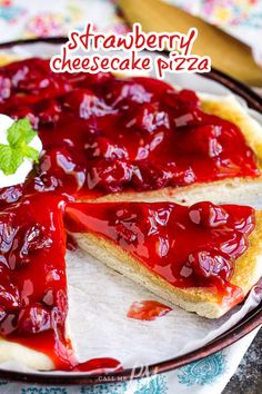 a strawberry cheesecake pizza is shown on a plate