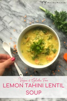 a bowl of lemon tahiti lentil soup with carrots and kale on the side