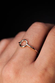 To create the Mini Circle Ring, we wrap a length of metal into a small circle and solder a band to either side! Its delicate circle design blends seamlessly with our other stacking rings, creating a stunning layered look. Designed to complement our circle collection, this ring adds understated elegance whether worn alone or paired with other circle-inspired pieces. This listing is for ONE SINGLE ring made in STERLING SILVER metal. Choose from a Hammered or Smooth finish! Its unisex design allows Single Ring, Bold Rings, Small Circle, Hammered Sterling Silver, Circle Ring, Circle Studs, Understated Elegance, Circle Design, Ring Sterling Silver