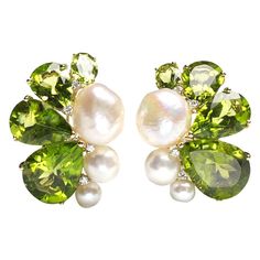 A pair of peridot, pearl and diamond earrings, set with eight graduating pear shaped peridots, with a total weight of 39.75ct, six cultured and baroque pearls, with a total weight of 34.55ct and eight, round brilliant-cut diamonds, with a total weight of 0.17ct, between the pearls and peridots, at intervals, mounted in 18ct yellow gold. Modern Diamond Earrings, Diamond Gold Earrings, White Diamond Earrings, Butterfly Earrings Gold, Vintage Stud Earrings, Diamond Cluster Earrings, White Gold Earrings Studs, Peridot Jewelry, Peridot Earrings