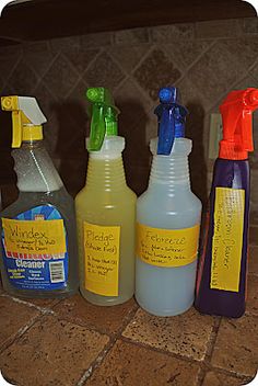 four different types of cleaning products sitting on a counter