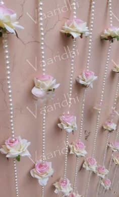 the wall is decorated with flowers and pearls