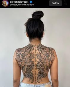 the back of a woman's body with tattoos on her upper and lower half