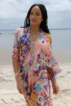 Give your casual wardrobe a stylish lift with this elegant Lasdon Kimono! Floral prints breathe a new life to the apparel, and a long flowy silhouette makes this stunner an ideal pick for all seasons! Materials: 100% Rayon 2PLY Size: 34" x 44" Made in India V-neck Boho Print Kimono For Beach Cover-up, Spring V-neck Beachwear Kimono, Flowy V-neck Kimono For Day Out, Summer V-neck Kimono For Loungewear, Pink Bohemian V-neck Kimono, Spring Floral Print V-neck Kaftan, V-neck Floral Print Festival Cover-up, Pink Kimono For Beach Cover-up, Pink Kimono For Beach Cover-up During Beach Season