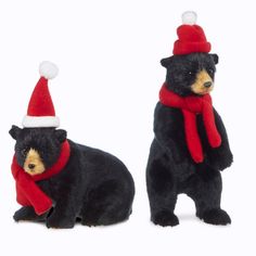 two stuffed bears wearing christmas hats and scarves, one is black with brown fur