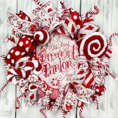 a red and white christmas wreath with candy canes