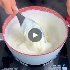 a person is mixing something in a bowl