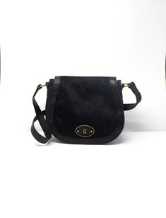 "Wonderful black classic, boho, modern, chick (depending on the outfit) cross-body bag/purse made of cowhide with magnetic closure, fabric line interior, two interiors wall pockets and one interior rear pocket. Large enough to holds your essentials. In great condition with minor signs of use. Durable leather, no scuffs or scratches.  Measure 10\" H X 11 1/4\" L X3 1/4\" W with 22\" strap" Retro Black Crossbody Shoulder Bag, Vintage Black Crossbody Hobo Bag, Vintage Black Shoulder Bag For On-the-go, Black Leather-lined Pouch Shoulder Bag, Black Vintage Bag With Snap Closure, Crystal Shot Glasses, Black Leather Crossbody Bag, Boho Modern, Wall Pockets