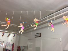 several children's toys are hanging from the ceiling