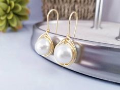 Check out this item in my Etsy shop https://www.etsy.com/listing/536220546/pearls-beige-earrings-pearls-earrings Elegant Dangle Pearl Earrings For Mother's Day, Elegant Adjustable Earrings For Mother's Day, Elegant White Earrings For Mother's Day, Round Bridal Earrings With Ear Wire, Dainty Nickel-free Pearl Earrings For Wedding, Pearl White Dangle Bridal Earrings As A Gift, Hypoallergenic Wedding Jewelry For Mother's Day, Hypoallergenic Jewelry For Wedding On Mother's Day, Elegant Hypoallergenic Earrings For Mother's Day