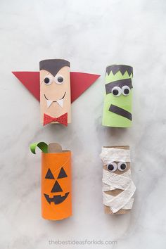 four toilet paper roll crafts with faces on them