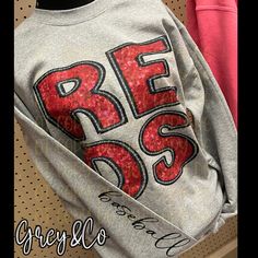 Reds Baseball-Faux means not real embroidery or sequin, printed to give the same look.  Tshirts are Gildan softstyle CVC and Sweatshirts are Gildan 50/50 blend; see size chart in listing photos. Materials - DTF printed  Please keep in mind colors may vary from different phone/computer screens.  Production-I can usually have these in the mail within a week. Shipping is USPS first class but if you need a rush/expedited shipping please don't hesitate to message me and we can get your order right ou Reds Baseball Game Outfit, School Spirit Embroidered Tops For Fall, College Red Tops With Embroidered Text, School Spirit Tops With Embroidered Text For Fall, Red College Tops With Embroidered Text, Red College Top With Embroidered Text, Fall School Spirit Tops With Embroidered Text, Red Embroidered Text College Tops, Fall Tops With Embroidered Text For School Spirit