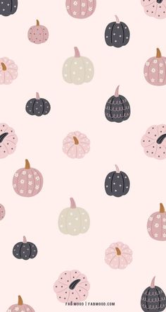 a pink background with black and white pumpkins