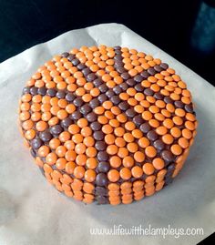 a cake decorated with chocolate and orange candies