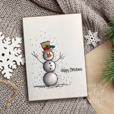 a christmas card with a snowman on it