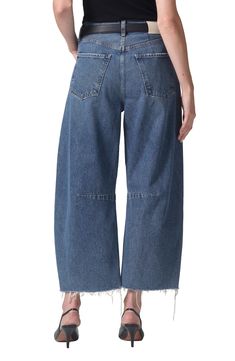 A superhigh waist and structured, curved wide legs cut a chic silhouette in these oversized, raw-cropped jeans crafted from nonstretch denim. 26" inseam; 21" leg opening; 13" front rise; 16" back rise (size 29)
 Button fly Five-pocket style 100% cotton Machine wash, tumble dry Made in the USA import of fabrics Modern Cropped Bottoms With Relaxed Fit, Modern High Waist Cropped Jeans In Rigid Denim, Modern Cropped Rigid Denim Bottoms, Wide Leg Rigid Denim Cropped Jeans For Work, Modern Rigid Denim Cropped Bottoms, Modern Denim Cropped Jeans With Wide Leg, Modern Wide Leg Cropped Denim Jeans, Modern Wide Leg Denim Cropped Jeans, Chic Wide Leg Cropped Jeans In Denim Blue